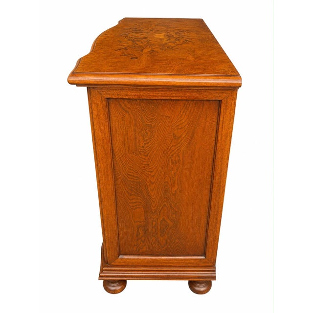 An elegant, high-quality Italian chest of drawers by Selva Stile, featuring a richly grained veneer surface and...