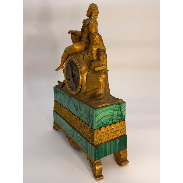 A handsome French Charles X period mantel clock combining richly figured green malachite with finely cast and chased gilt...