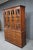 Classic mahogany breakfront china cabinet by Henkel Harris, crafted in a traditional style with clean proportions and...