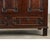 An English, solid oak mule chest from the mid-18th century or earlier, this heavy storage trunk has a paneled exterior...
