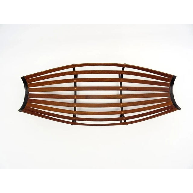 Very decorative fruit bowl in teak in excellent quality. Original from the 50s. An object from the Austria of the Carl...