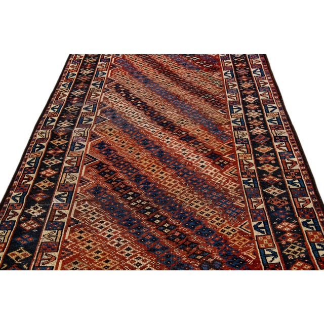 Beautiful modern Kurd hand-knotted wool runner with a rust field. This piece has multicolor accents in a gorgeous all-over...