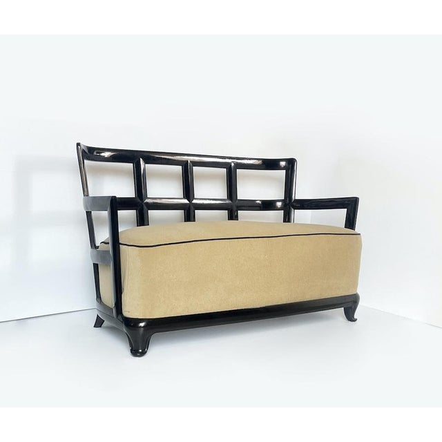 Unique 1930s Art Deco sofa with a "grid" structure made entirely of black lacquered wood. The sand-colored fabric seat...