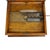 This antique Regina double comb disk music box is crafted from oak, featuring a rich, warm finish. The hinged lid opens to...