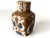 Scandinavian ceramic piece by Nils Thorsson for Royal Copenhagen. A small, square-shaped vase featuring the "Baca"...