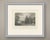 Warwick Castle is seen from the river in this steel engraving, its long battlemented range of buildings rising above the...