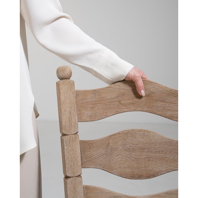 A cohesive set of dining chairs crafted from oak, featuring simple lines and durable construction. Designed for everyday...