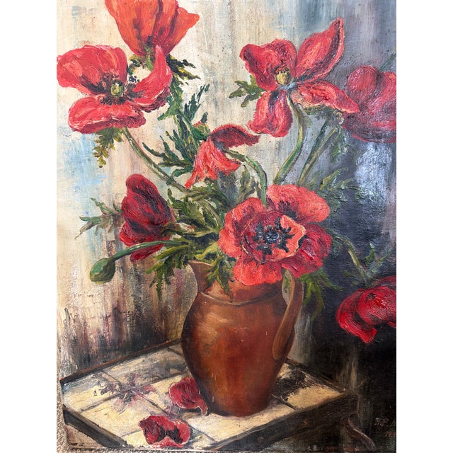 Original signed 1946 oil on canvas depicting red poppies in a vase. Presented in a gilt frame with vibrant color,...