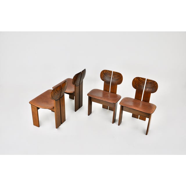 Set of 4 Africa chairs in wood and brown leather by Afra & Tobia Scarpa. Seat height: 45 cm. Stamped. Wear consistent with...