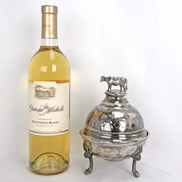 Add a touch of whimsical vintage charm to your table with this delightful silver-plated butter dish! The silver plate...