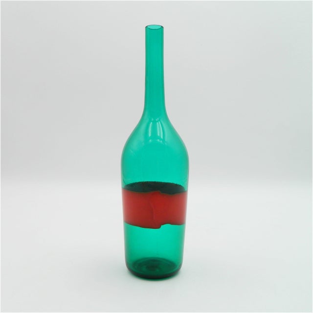 A rare bottle vase from the renowned Murano firm of Paolo Venini, designed by Fulvio Bianconi. The bottle-shaped vase is...