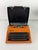 Adler Contessa portable typewriter, 1970 Retro design object known for its bold, bright orange color. Complete and in good...