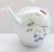 Very pretty porcelain teapot by Bernardaud. Fresh flower motif. Measures 6 1/2" tall by 9 1/2" wide. Great condition...