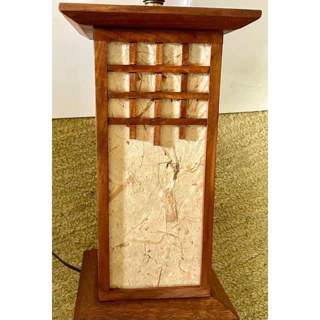 This MCM table lamp has been crafted from a 4-panel Japanese lamp with rice paper panels.