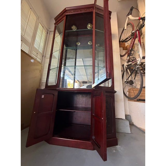 A stunning, premium grand-scale hexagonal curio cabinet crafted from genuine, high-density solid Asian Rosewood....