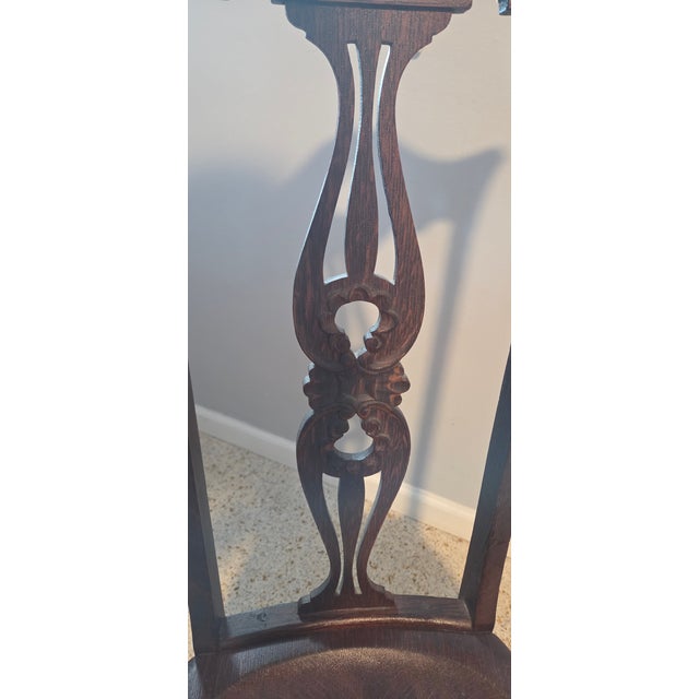 Unique Oak Keyhole & Harp Accent Chair with a rich dark stain. 44 inches high by 17 wide and the seat is 18 inches from...