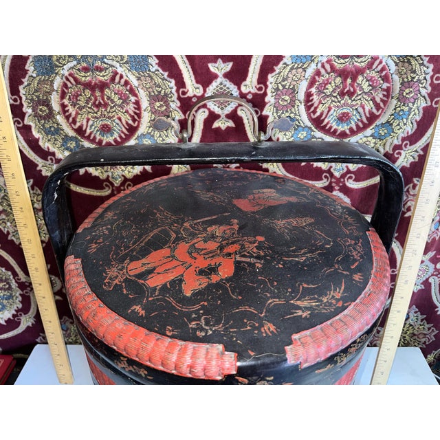 A beautifully aged Chinese rattan basket. Possibly a wedding basket? 3 sections to store your things. Sure to add an Asian...