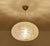 Vintage Doria Glass pendant light featuring a cocoon shade with signature "lava flow" patches, polished brass cover and...