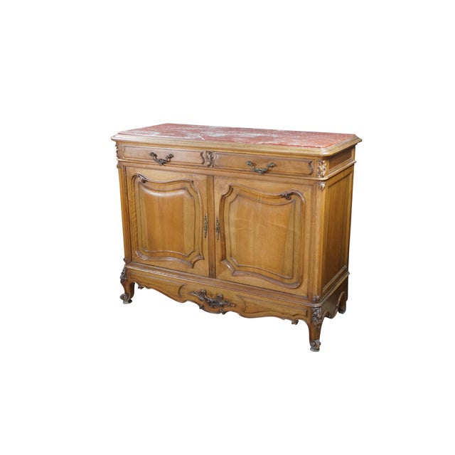 This exceptional antique French Provincial commode or sideboard showcases premium walnut craftsmanship and elegant Louis...