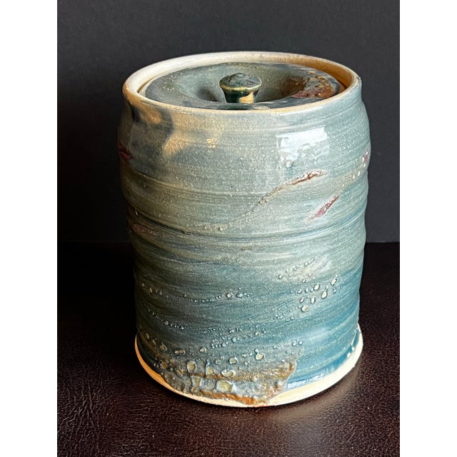 Vintage, hand made wabi sabi mizushashi glazed in a light teal with purple streaks. Estimated to be from the 1980s....
