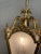 Elegant brass lantern available. Featuring shaped glass panels, twisted arms, and delicate floral detailing, this piece...