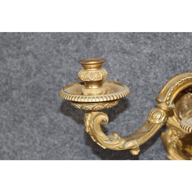 This exceptional set of four late 19th-century French gilt-bronze wall sconces is distinguished by the remarkable quality...
