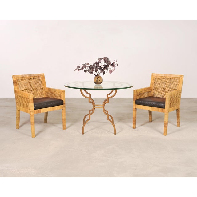A sublime late 20th century set of four rattan cane dining armchairs designed by Billy Baldwin and hand-crafted by...
