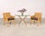 A sublime late 20th century set of four rattan cane dining armchairs designed by Billy Baldwin and hand-crafted by...