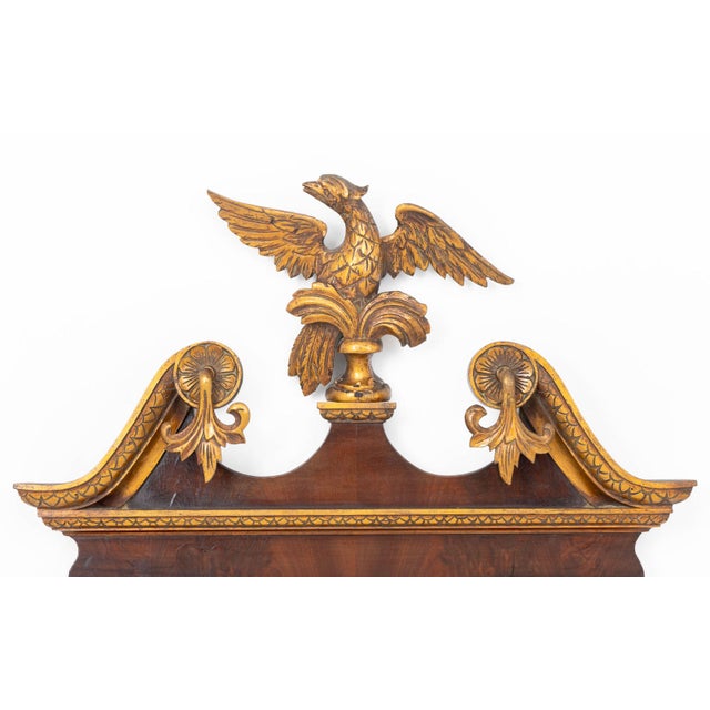 George II Style Mahogany and Parcel Gilt Mirror, 19th century, with carved eagle cresting. Mirror plate: 26.25" H x 17.5"...