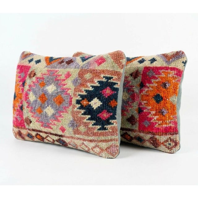 This beautiful 16'' x 24'' pillow cover set was made from authentic Turkish rug pieces. Bright colors of wool adorn the...