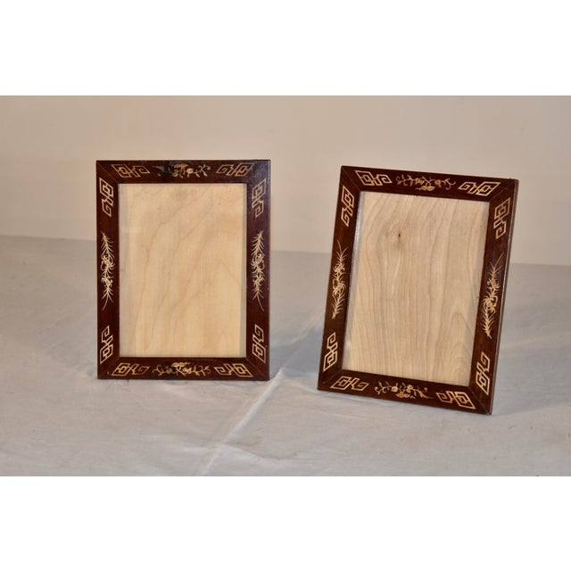 Pair of 19th century rosewood picture frames with bone inlay. This is a lovely pair of picture frames, with newly...