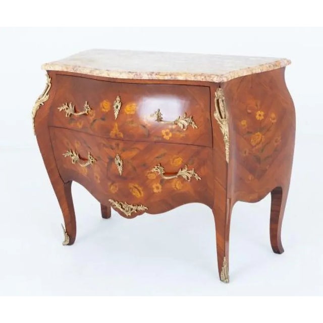 French walnut commode in the Empire revival style Circa 1900 This lovely commode is of a typical French bombe and...