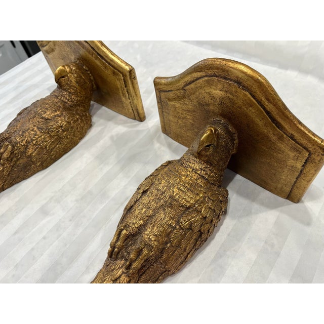 A pair of vintage gilt gold tone parrot wall bracket shelves. No marks. Seem to be made of a heavy resin. Measures about...