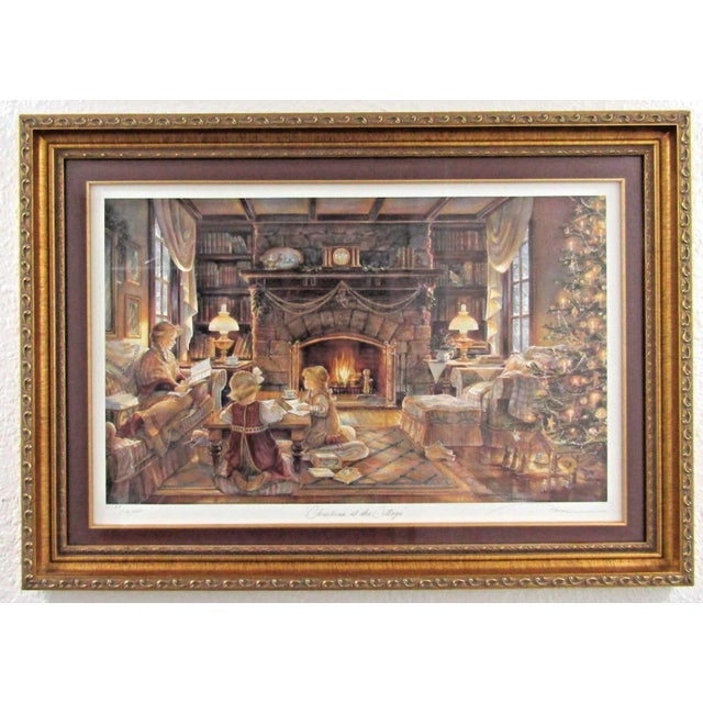 A matted and framed, numbered print by artist Trisha Romance titled "Christmas at the Cottage." This medium-sized...