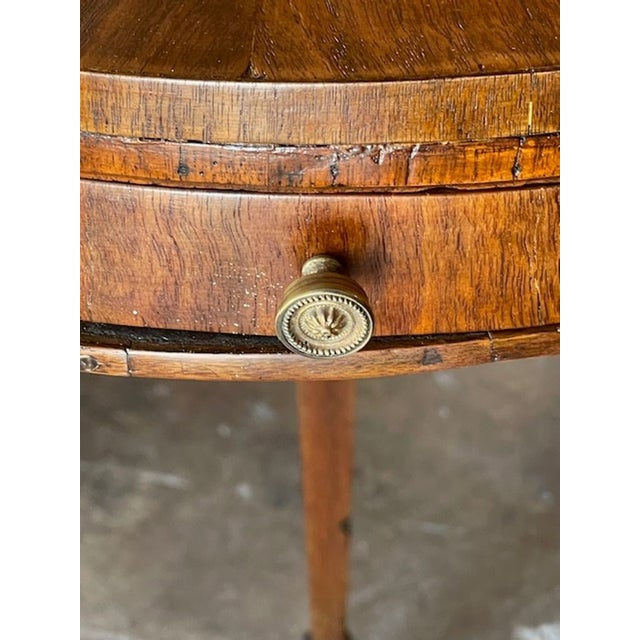This 19th century Italian walnut side table is a timeless piece of furniture that adds elegance and charm to any room....