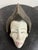Design Plus Gallery presents an African Punu-Style Carved Wood Mask. Carved from wood, this sculptural mask presents an...