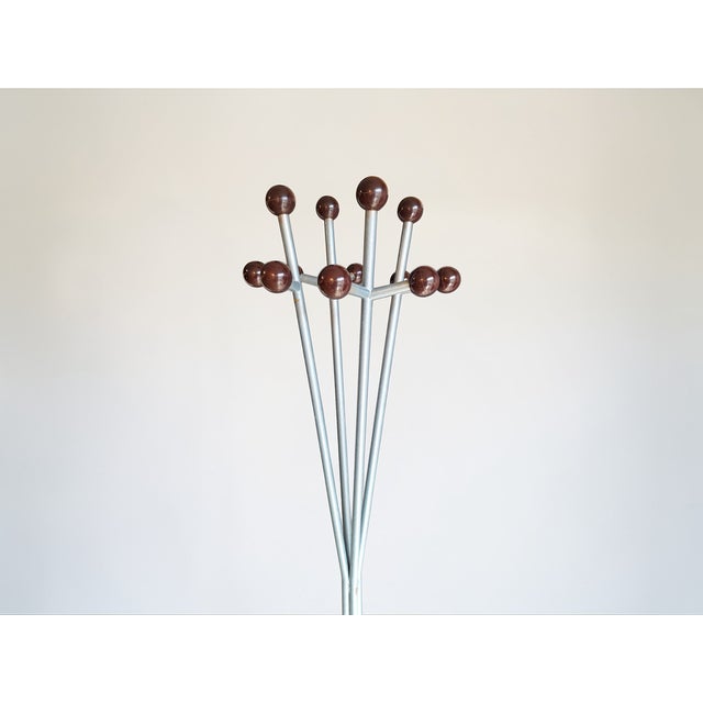 Coat stand with umbrella stand made of enameled iron and 12 plastic hangers. The coat stand is very sturdy and can hold...