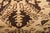 Hand-knotted in wool originating from India circa 1910-1920, this 9x12 antique rug connotes an Agra design in a...