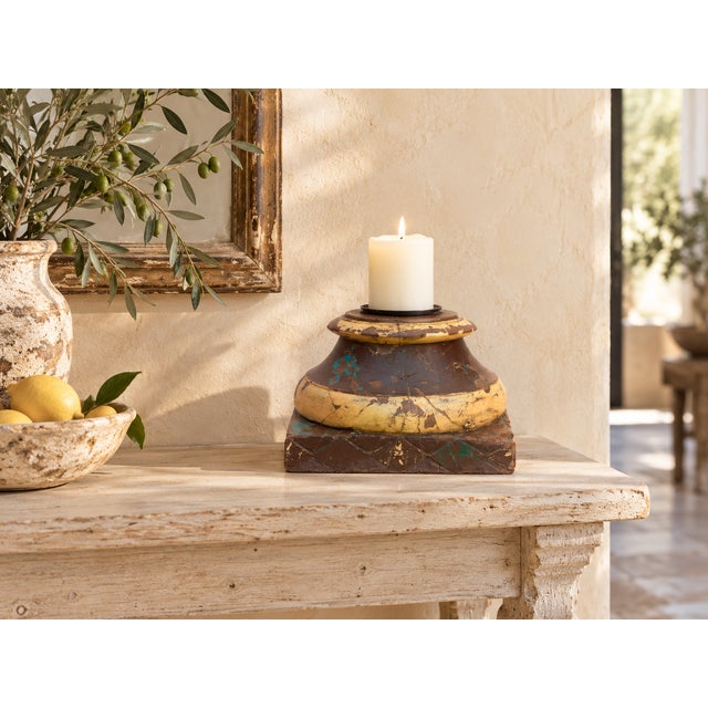 Start at the foot. A square plinth wears a diamond lattice pattern in chocolate brown, with small green and teal accents...