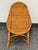 Design Plus Gallery presents a Vintage Rattan Scoop Back Side Chair. The chair has a rounded high back, woven rattan seat,...