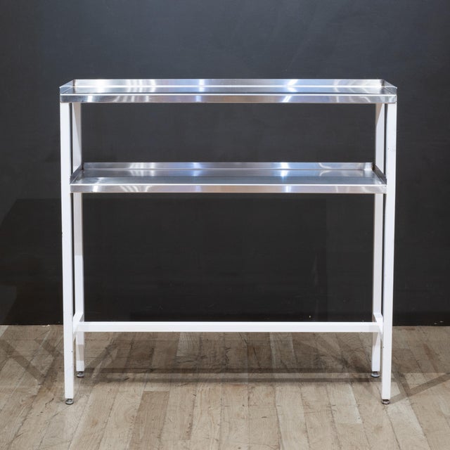 ABOUT A vintage painted metal hospital table with stainless steel shelves and adjustable metal feet. CREATOR Unknown. DATE...