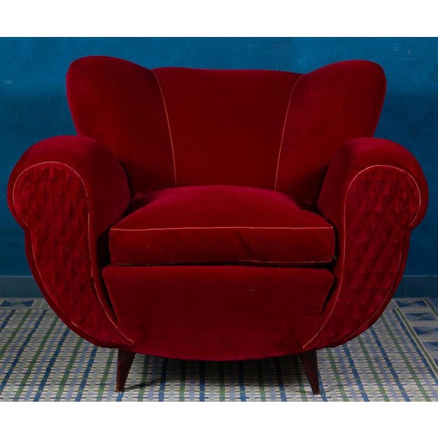 Very comfortable pair tulip shape red velvet of armchairs with scrolled hand holds . Soft and beautiful original vintage...