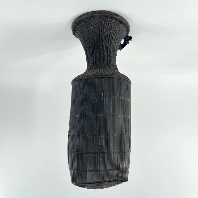 This old Kuba handwoven basket is a testament to the artistry of the Kuba people in the Democratic Republic of Congo....
