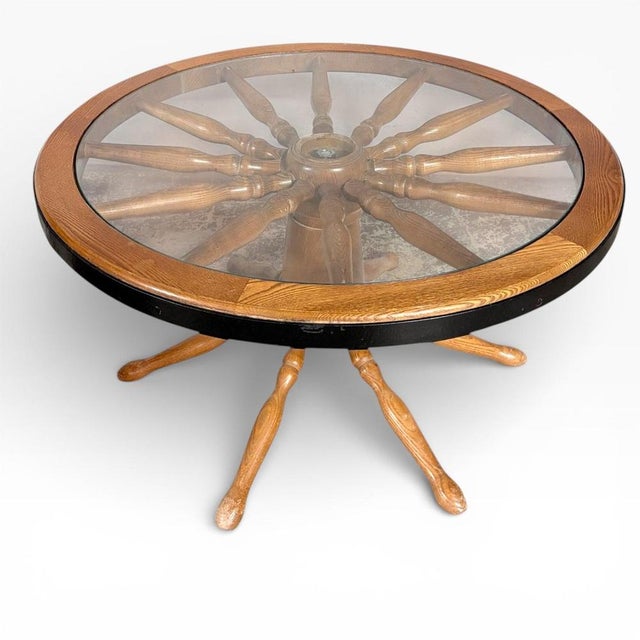 The vintage ship wheel table combines classic maritime style with practical function, making it an ideal centerpiece for...