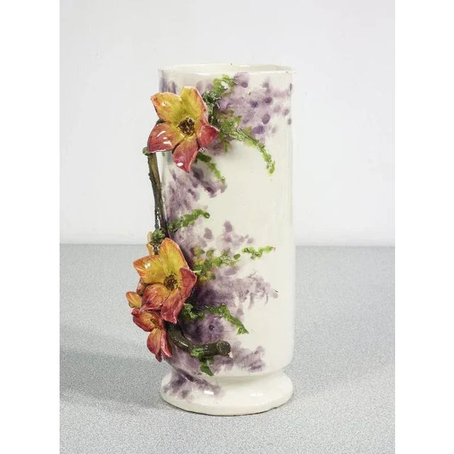 Pair of barbotine ceramic vases, decorated with flowers and leaves. Origin france period 1930s model pair of vases with...