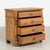 This pine chest of four drawers has columns accenting the central three drawers which are slightly inset creating...