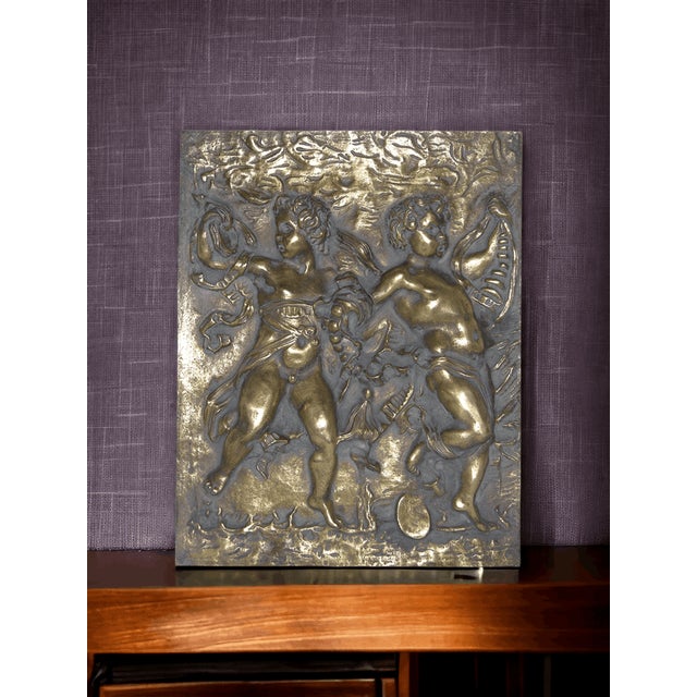 Embossed Bronze Tile with Dancing Cupids attributed to Leonardo Da Vinci, in Flawless conditions. Designed before 1890