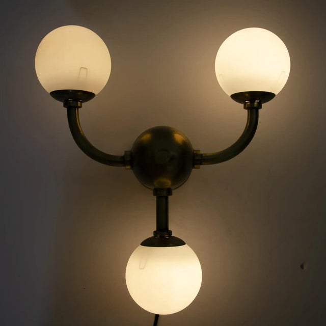 With vintage inspirations elevated by a slightly whimsical modern aesthetic, the handcrafted Bari 3 bulb sconce is an...
