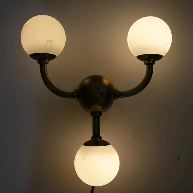 With vintage inspirations elevated by a slightly whimsical modern aesthetic, the handcrafted Bari 3 bulb sconce is an...