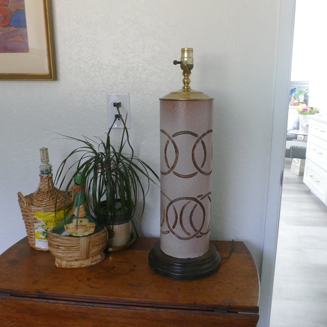 Make a bold statement with this substantial vintage Mid-Century ceramic table lamp featuring an elegant cylindrical form...